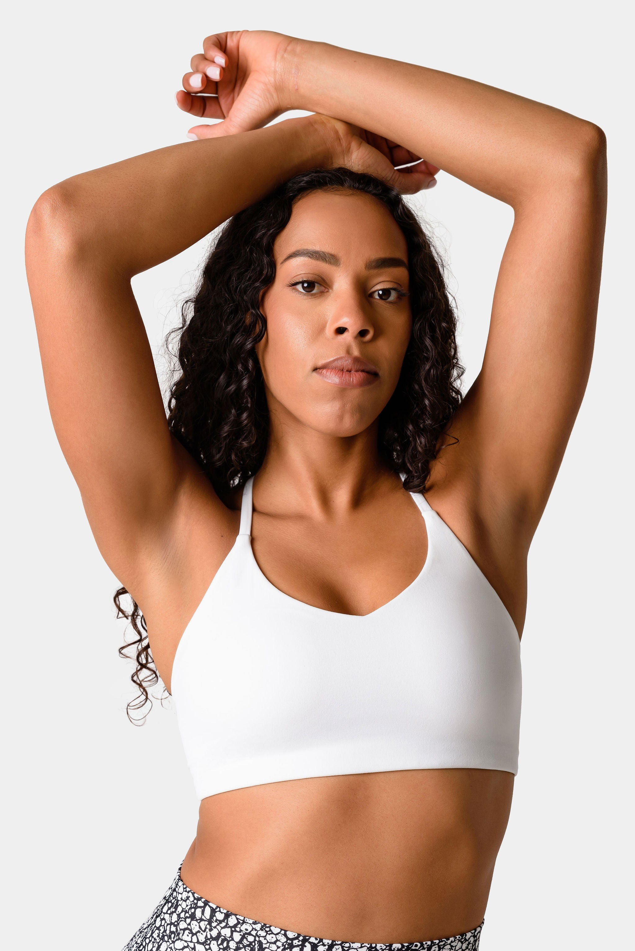 Growth Scoop Neck Open Back Sports Bra In Black | Oh Polly
